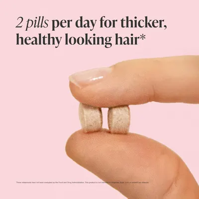 Highlights the key benefit of taking the product - achieving thicker and healthier looking hair.