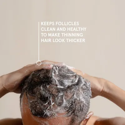 Highlights the product's ability to keep hair follicles clean and healthy, making thinning hair appear thicker.