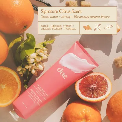 Highlights the product's signature citrus scent, describing it as a sweet, warm, and citrusy aroma reminiscent of an easy summer breeze.