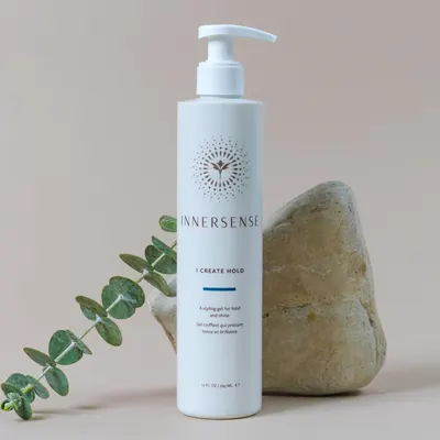 Highlights the product's ability to provide hold and shine for hairstyling.