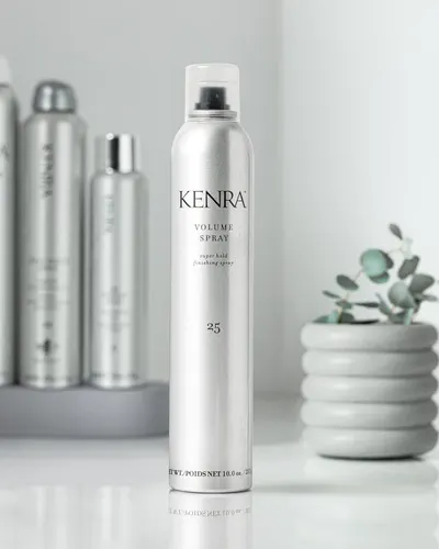 Highlights the volume spray's ability to provide long-lasting hold and voluminous hair styling.