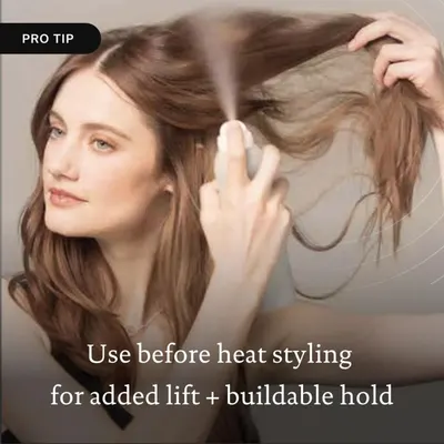 Provides a tip on how to use the product before heat styling to achieve added lift and buildable hold for hair.