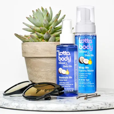 Shows the different hair care products included in the Lottabody Coconut & Shea Oils line, highlighting the key ingredients.