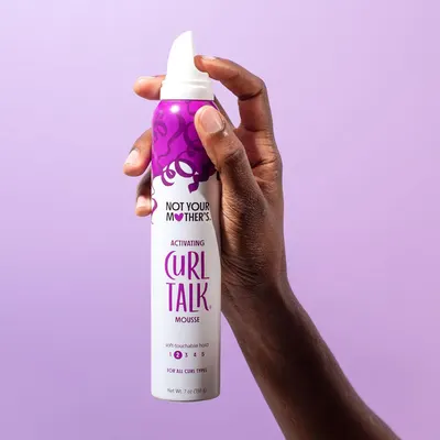 Highlights the product's curl-defining and holding abilities for curly hair.