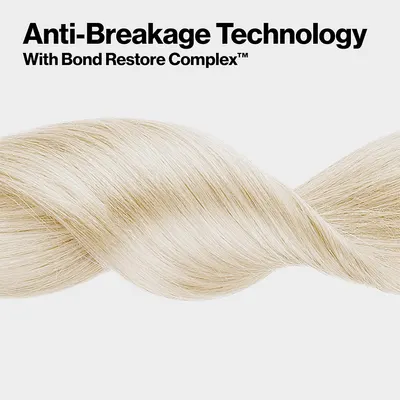 Highlights the product's anti-breakage technology and Bond Restore Complex as a key feature to prevent hair damage and breakage.