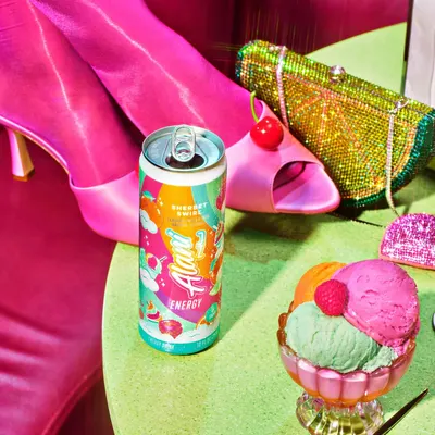 Showcases the product in a vibrant summer party setting to associate it with fun, festive occasions. Displays the product alongside trendy fashion items to appeal to style-conscious consumers.