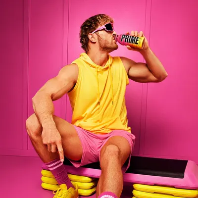 Shows the product being consumed in an energetic, fitness-oriented context to appeal to health-conscious consumers. Reinforces the brand's bold and energetic identity through a striking pink and…