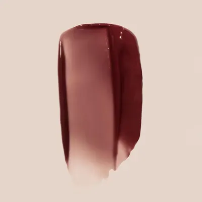 Showcases the specific shade and texture of a beauty product, likely lipstick or nail polish.