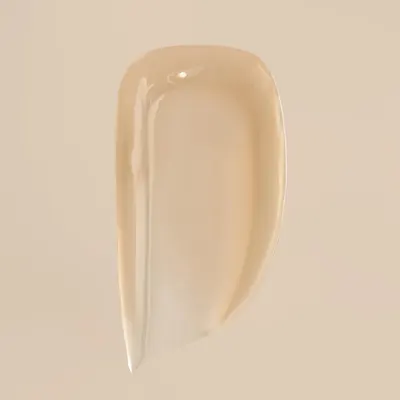 Demonstrates the creamy, smooth texture of the product to highlight its quality and ease of application.