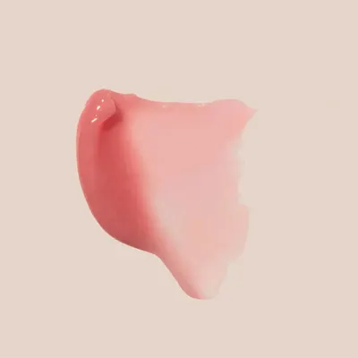 Demonstrates the product's creamy, smooth texture to highlight its easy application and blendability.
