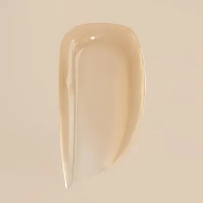 Demonstrates the creamy, smooth texture of the product to highlight its quality and ease of application.