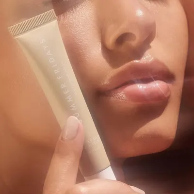 Showcases the lip product's ability to provide hydration and a natural, glossy finish to the lips.