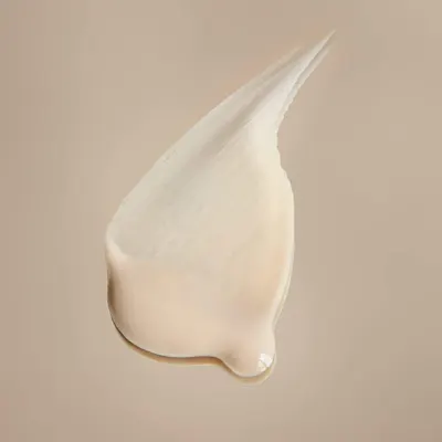 Showcases the creamy, smooth texture of the product to highlight its quality and ease of application.