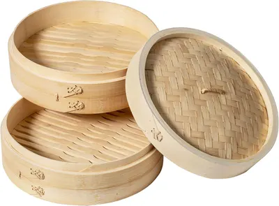 Shows the complete set of bamboo steamer baskets and lid that the customer will receive, demonstrating the product's components and stackable design.