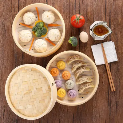 Showcases the versatility of the steaming basket for preparing different types of dumplings and steamed foods.