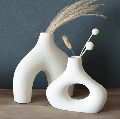 Showcases the product in a stylish, minimalist home setting to appeal to design-conscious consumers.