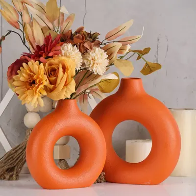 Showcases the product as a stylish seasonal decoration for fall, emphasizing warm colors and floral arrangements. Demonstrates how the product can be used to create an attractive display in a home…