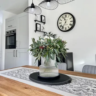 Showcases the product in a stylish, contemporary kitchen setting to help shoppers envision how it would look in their own home.
