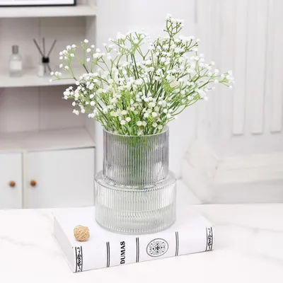 Shows how the product can be used to create an elegant and fresh atmosphere in a home setting.