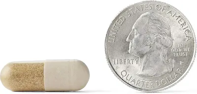 Demonstrates the small size of the pill by comparing it to a quarter, helping customers understand its easy-to-swallow dimensions.