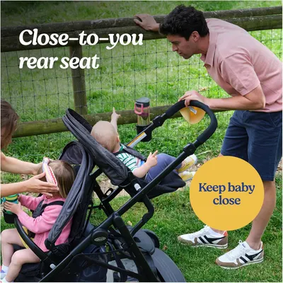 Highlights the stroller's feature of having a rear seat that keeps the baby close to the parent, emphasizing the benefit of maintaining proximity and connection with the child while on the go.
