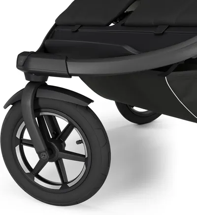 Highlights the sturdy and reliable wheel design of the stroller, emphasizing its quality construction and smooth maneuverability.