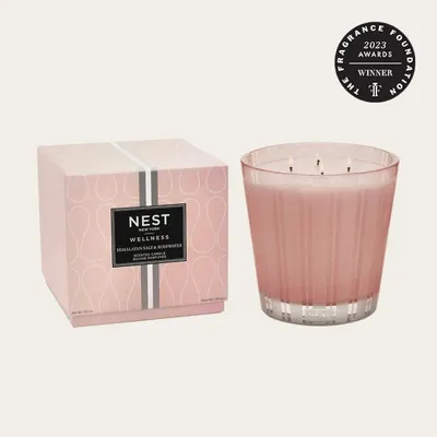 Highlights that the product won a 2023 award from The Fragrance Foundation, building credibility and prestige. Shows the complete product offering, including the candle itself and its decorative…