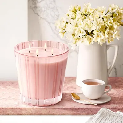 Showcases the product in a stylish, relaxing home setting to appeal to customers seeking to create a cozy atmosphere.