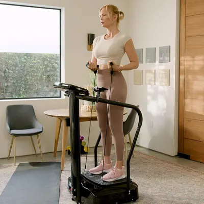 Shows the product being used in a home setting, demonstrating how it fits into everyday life and can be used in small spaces. Illustrates how the product can be used for fitness at home, even in a…