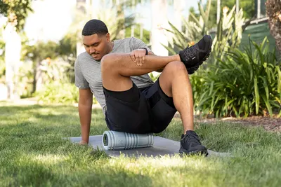 Demonstrates the product's use for outdoor fitness and muscle recovery, showing its versatility in different exercise settings.