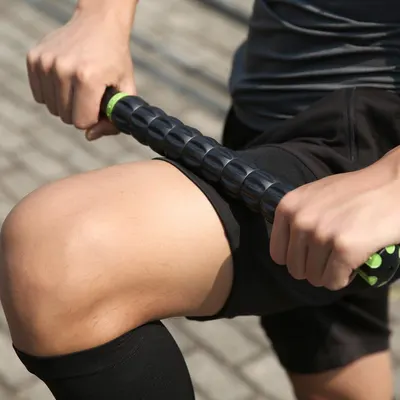 Demonstrates how to use the product for muscle recovery or massage, focusing on proper technique for the thigh area.