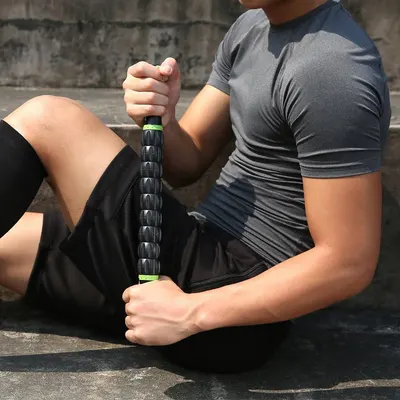 Demonstrates the product being used in a real-world fitness context, showing how it can be applied for muscle recovery or massage after exercise.
