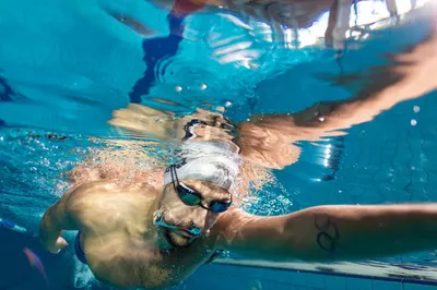 Demonstrates the product in use during intense swimming, showcasing its performance and suitability for athletic activities.