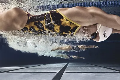 Showcases the product in action during competitive swimming, emphasizing its suitability for high-performance aquatic sports.