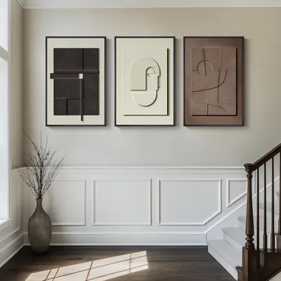Showcases how the abstract art pieces can be used to create a sophisticated, minimalist aesthetic in a home setting.