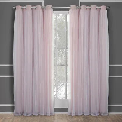 Shows the curtains installed in a real room setting to help shoppers visualize how they would look in their own home.