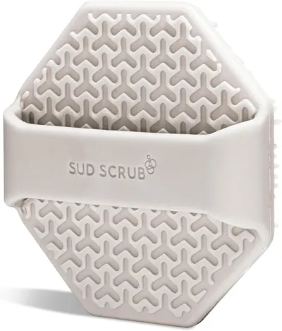 Highlights the product's unique textured surface design for effective cleaning and scrubbing.