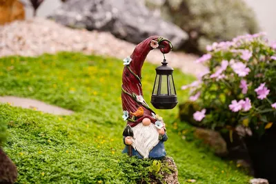 Showcases the product in a realistic garden setting to demonstrate its decorative appeal and how it enhances outdoor spaces.