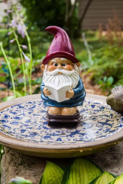 Shows the product in a realistic garden setting to demonstrate how it can be used as decorative outdoor decor.