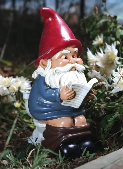 Shows the product in a natural garden setting to demonstrate its use as outdoor decoration.