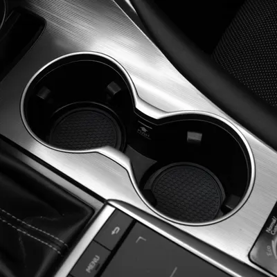 Highlights the high-quality, well-designed cup holders in the vehicle's interior to showcase attention to detail and convenience.