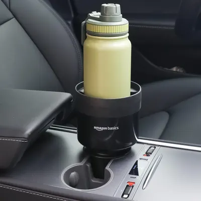 Demonstrates how the product fits and functions in a car cup holder, showing its practicality for on-the-go use.