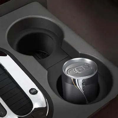 Highlights the product's cup holder feature, showing its ability to securely hold a beverage can.
