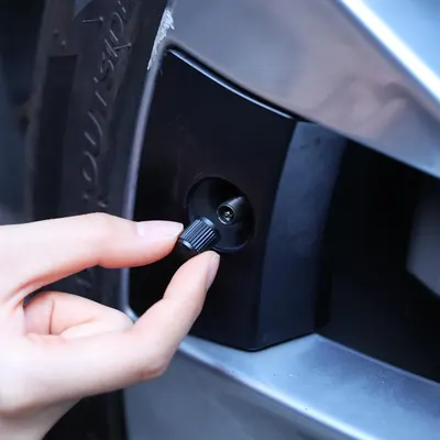 Demonstrates how to access and use the tire pressure monitoring system, showing the ease of checking tire pressure.