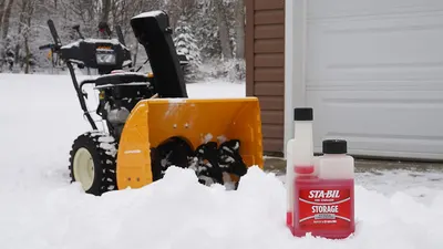 Demonstrates the use of STA-BIL fuel stabilizer for storing winter equipment like snow blowers during off-season. Associates the product with winter maintenance tasks, showing its relevance for…