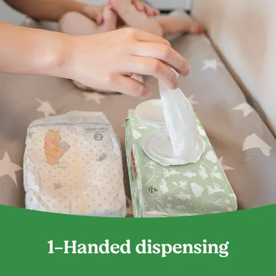 Demonstrates the ease of use by showing how wipes can be dispensed with just one hand, highlighting convenience for parents.