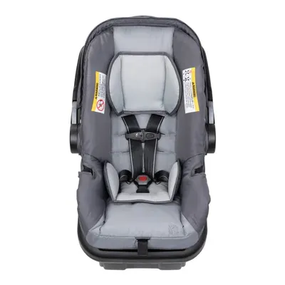 Demonstrates the safety features of the car seat, particularly the secure 5-point harness system, to reassure parents about their child's protection.