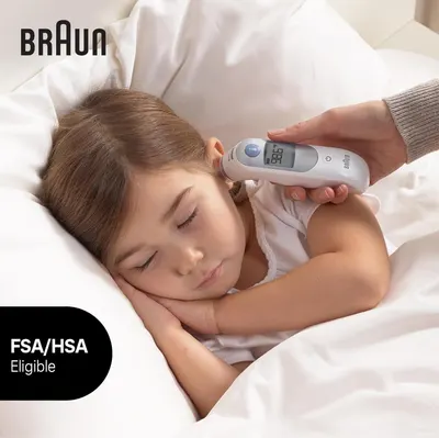 Demonstrates the ease and comfort of using the Braun thermometer to measure a child's temperature while they sleep.