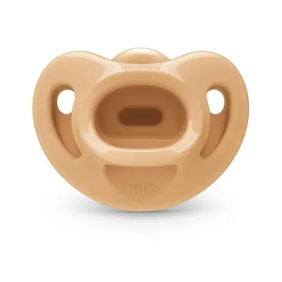 Highlights the pacifier's ergonomic shape designed to fit comfortably in a baby's mouth.