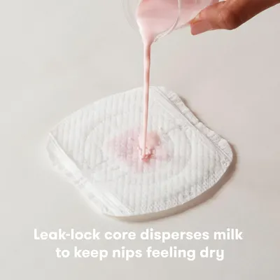 Demonstrates how the product's leak-lock core disperses milk to keep nipples feeling dry, highlighting its effectiveness in preventing leaks.